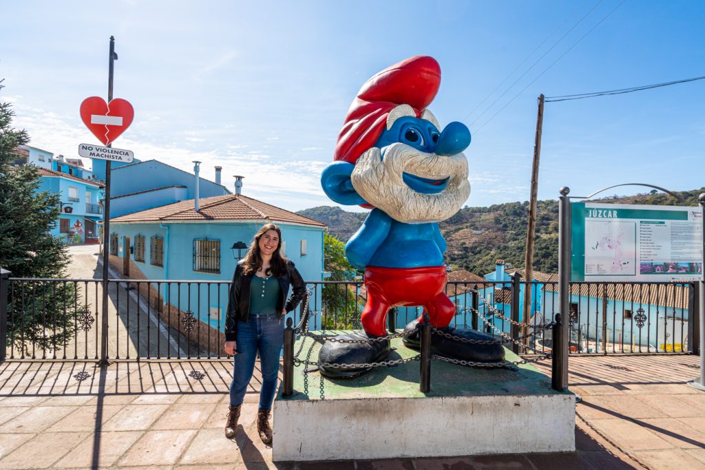 kate storm posing with statue of papa smurf spain juzcar