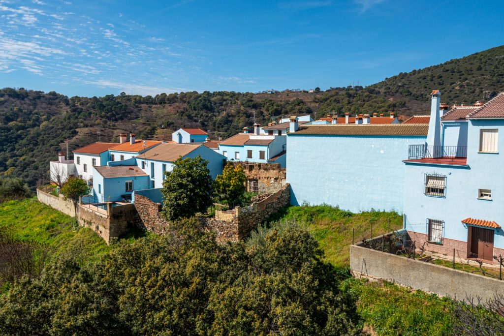blue town spain with forest to the left