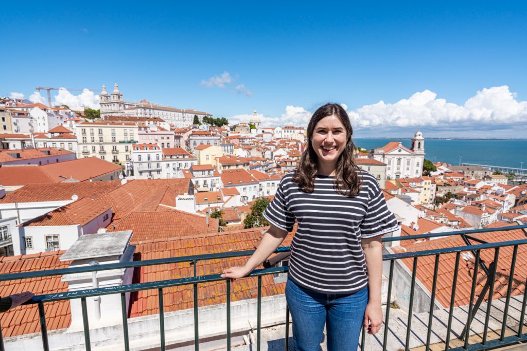 kate storm standing at the miradouro das portas do sol, the most famous lisbon viewpoint