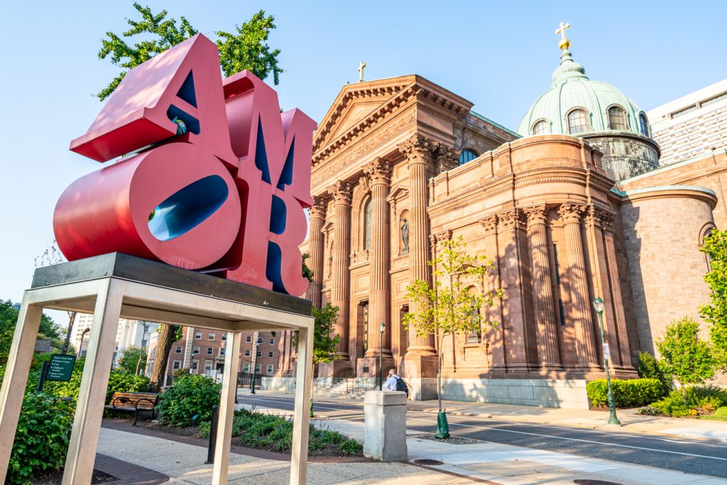 amor statue with cathedral in the background, one of the best stops during an itinerary for philadelphia in 3 days