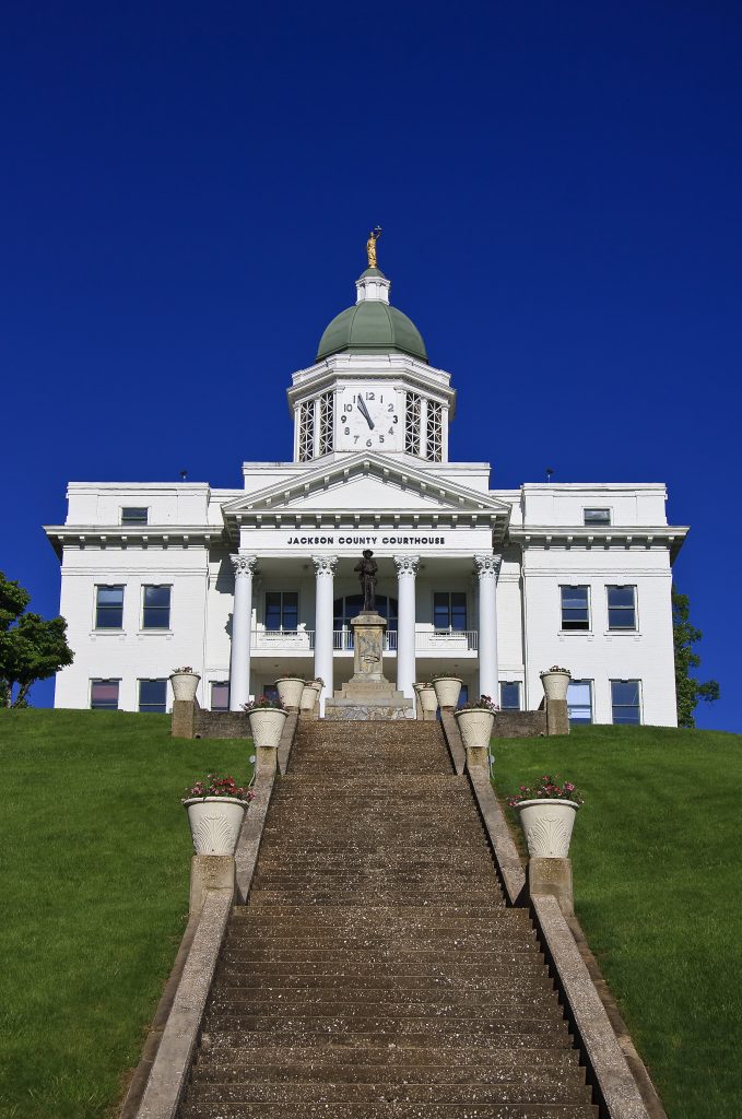 white courthouse with clocktower in sylva north carolina, one of the best mountain towns nc