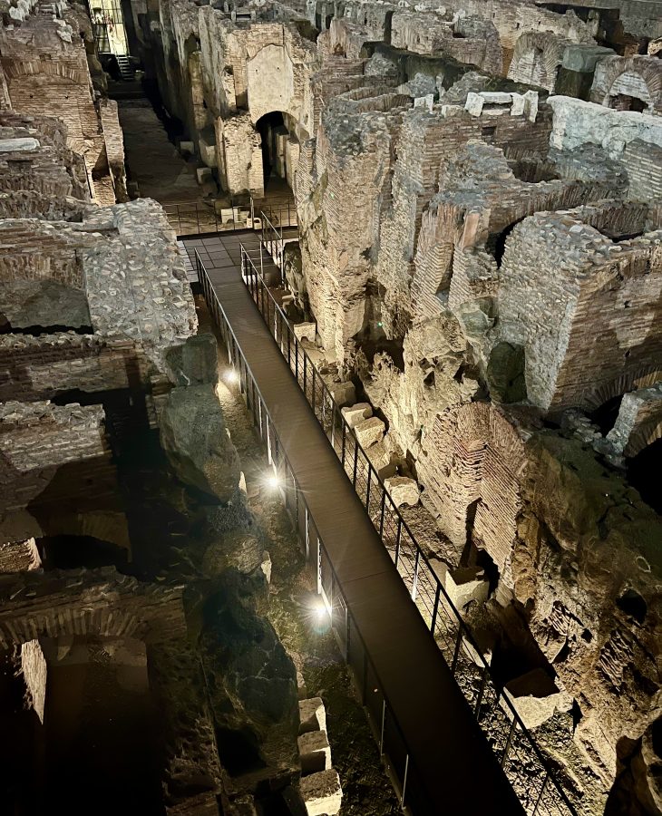 view of colosseum underground at night as seen when looking in from above