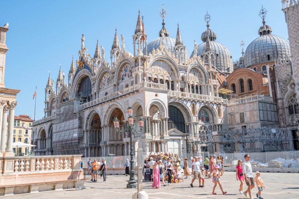 tourists walking in front of st marks basilica in venice italy