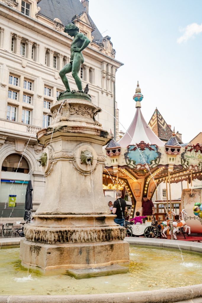 francois rude square, one of the best places to visit in dijon france with fountain in foreground