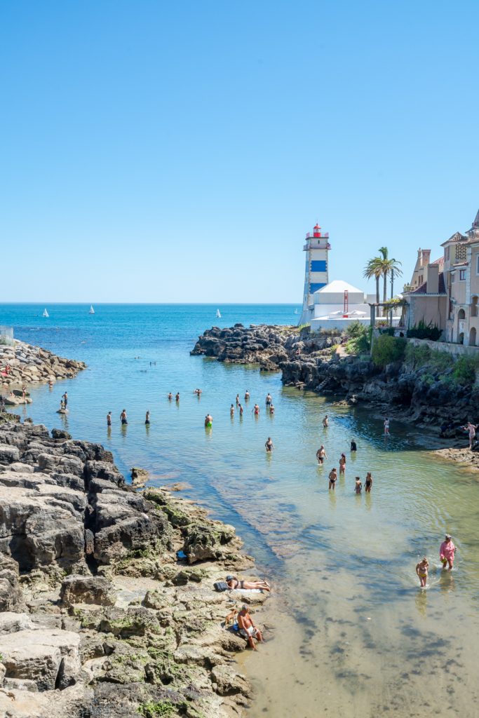 lighthouse and swimming hole on the sea in cascais portugal