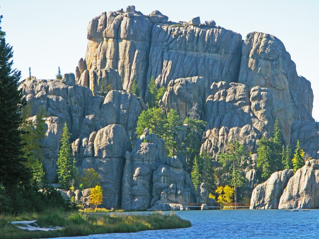 view of cylvan lake with rock formations in the background in south dakota