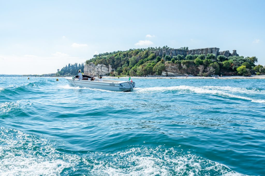 view of lake garda from a boat tour in sirmione italy