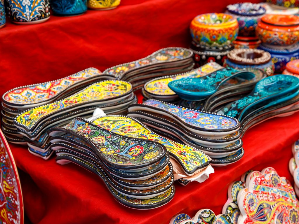 collection of ceramic spoon rests for sale at a tourist souvenirs market