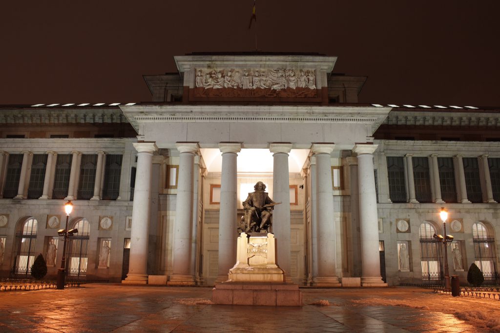 front facade of the prado museum madrid after dark