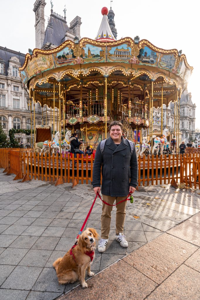 jeremy storm and ranger storm in front of hotel de ville carousel at paris christmas market