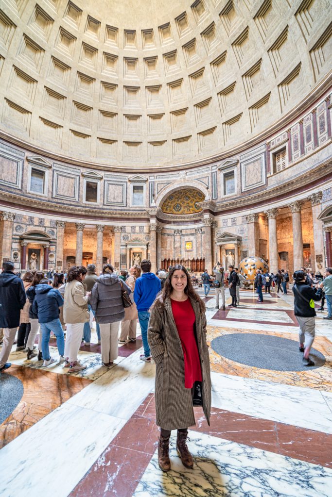 kate storm tanding inside the pantheon one day in rome italy