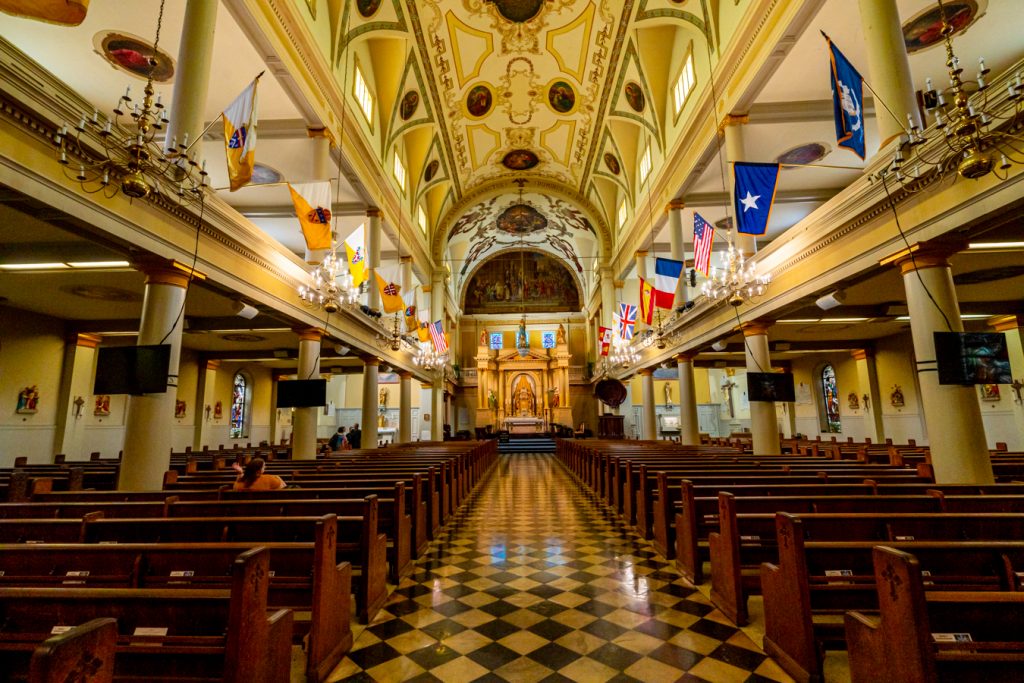 interior of st louis cathedral in new orleans french quarter with checkered tile floor