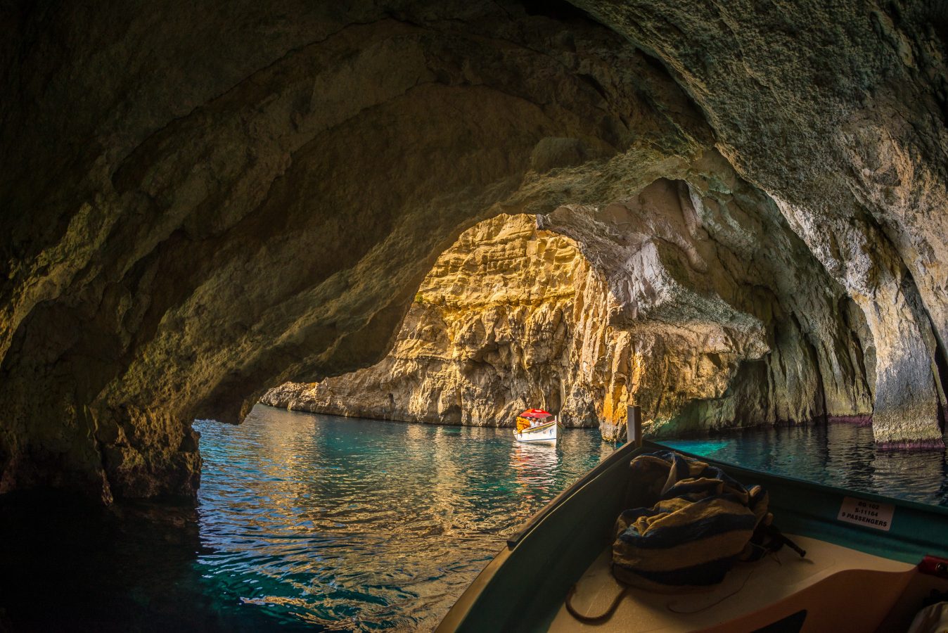 view of 2 boats inside malta blue grotto