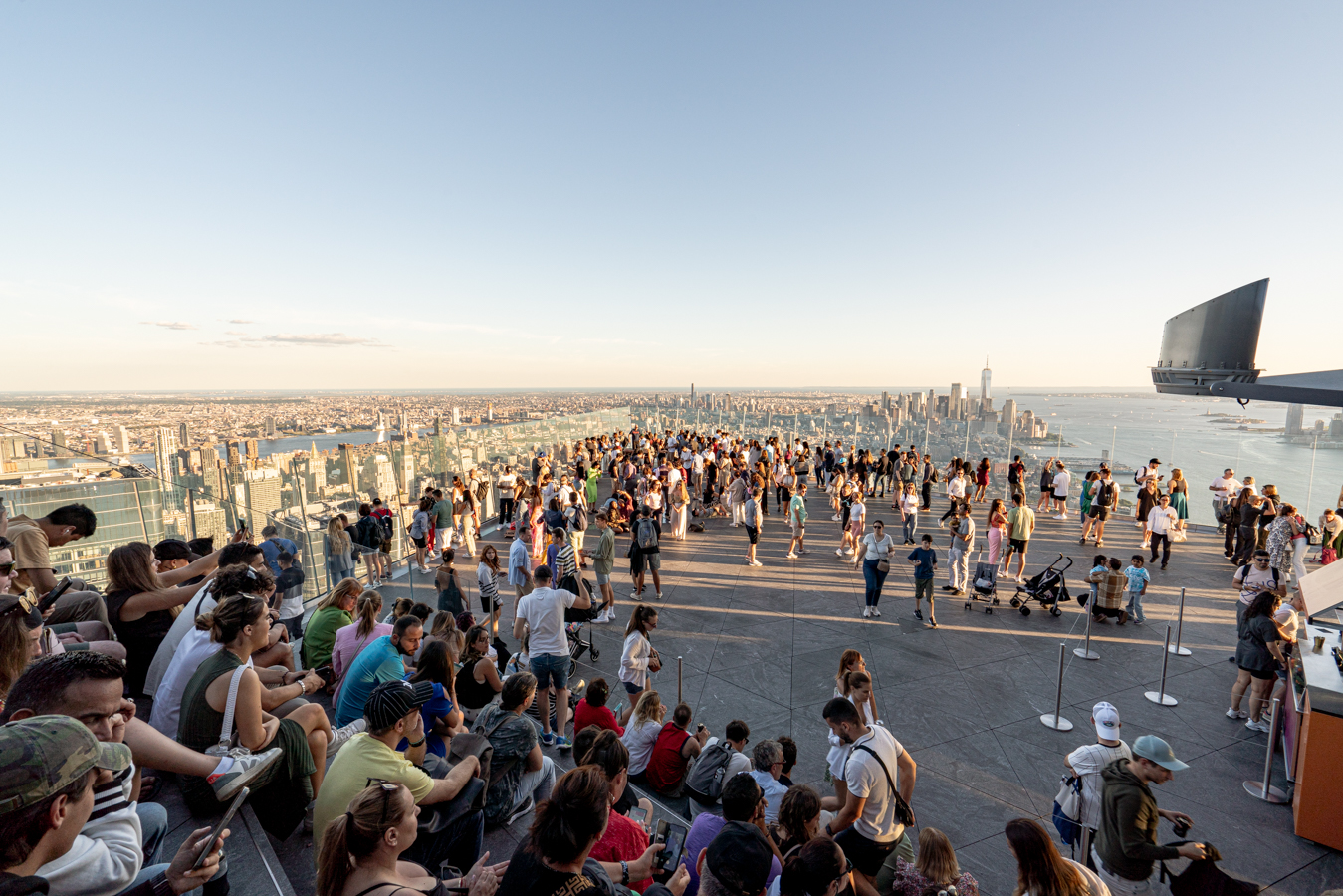 view of crowds at the edge in nyc at sunset