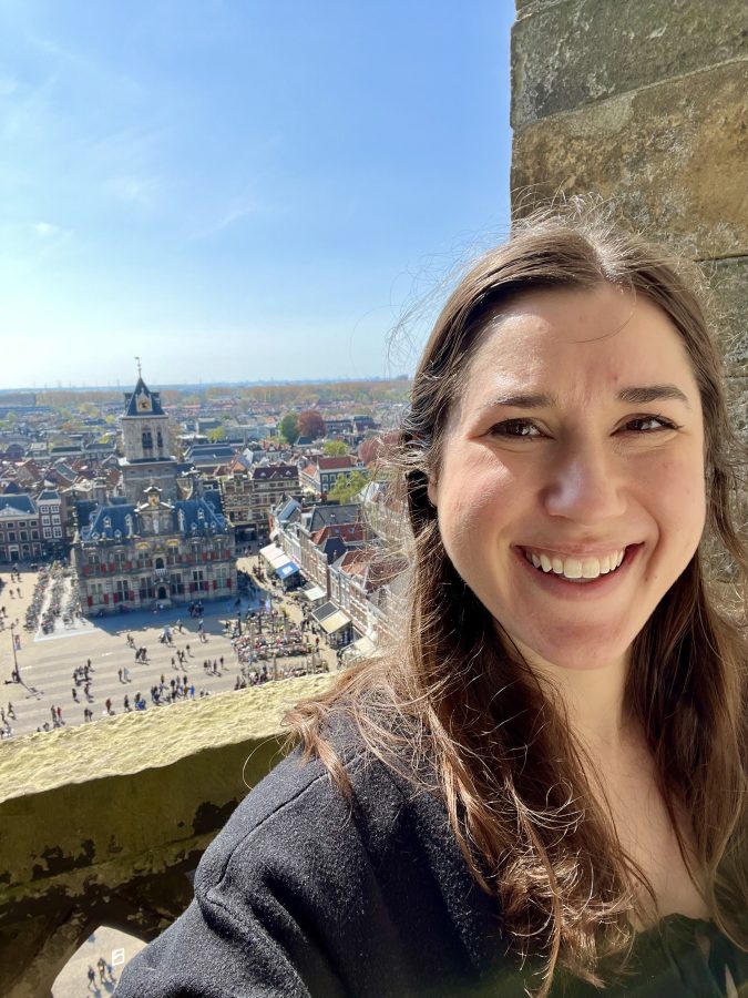kate storm taking a selfie from the delft nieuwe kerk tower with the markt visible in the background, one of the best things to do in delft