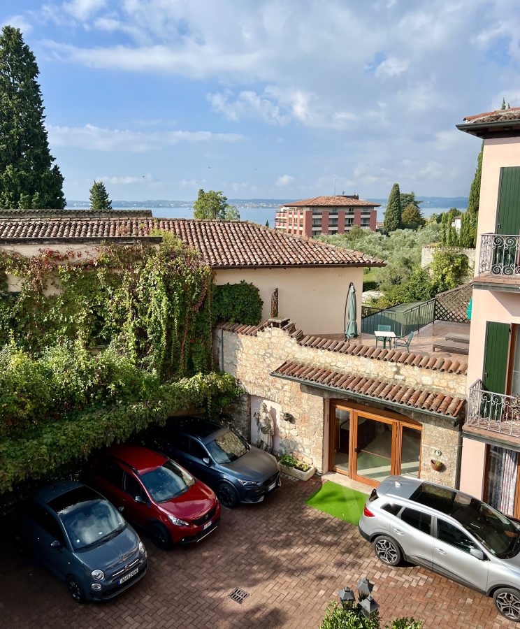 collection of cars parked in the hotel meridiana parking lot