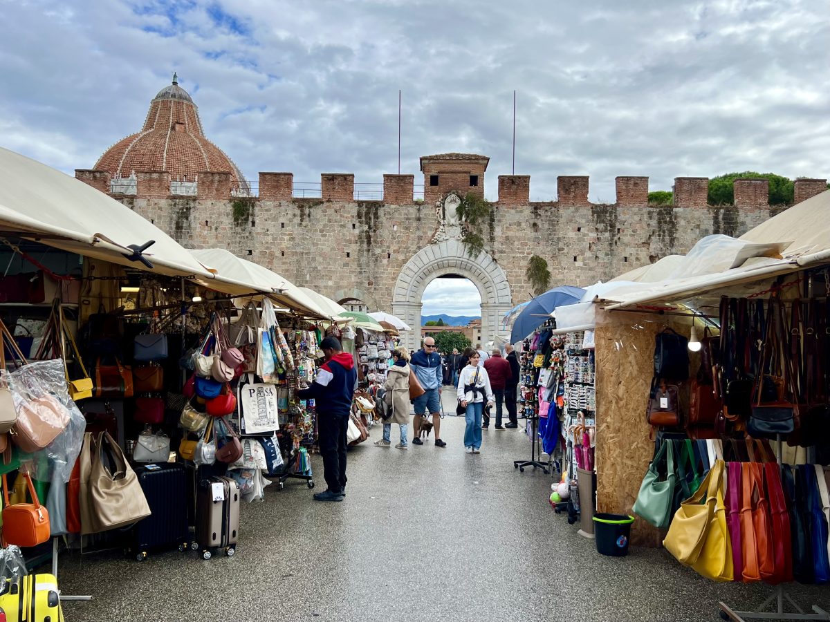 market outside of the piazza dei miracoli near bus stop in pisa italy