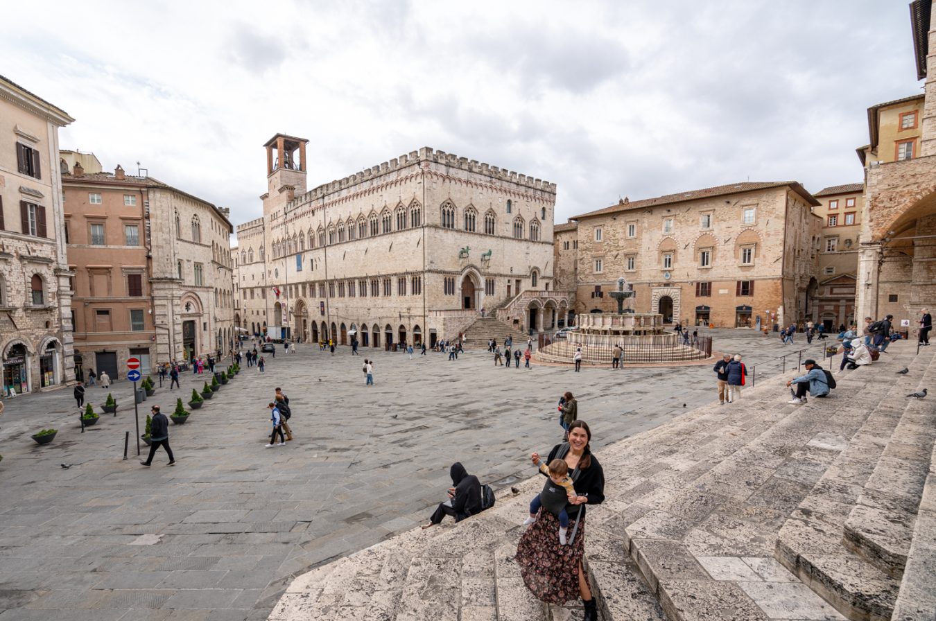 kate storm and her baby standing on the steps of the perugia cathedral in piazza iv novembre, one of the best places to visit perugia umbria