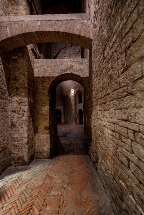 arched doors leading through a hallway in rocca paolina perugia