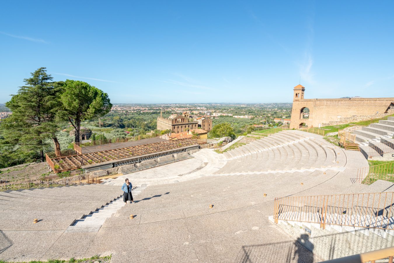 kate storm standing in the roman theater at the sanctuary of hercules victor, one of the interesting things to see in tivoli italy