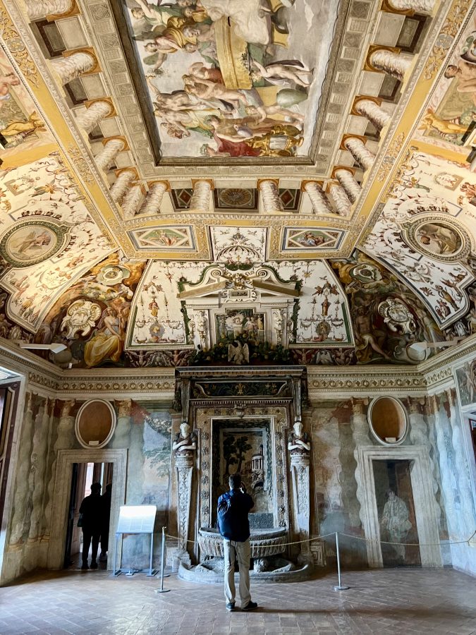 interior of villa d'este in an intricately decorated room covered with frescoes